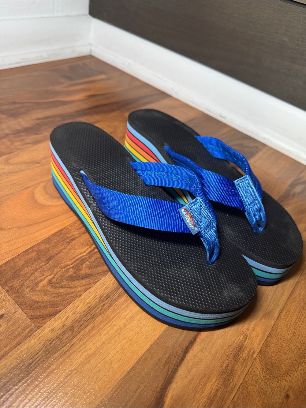 Rainbow womans Black Flip Flops with Bright Blue Straps and RainbowWafer Midsole